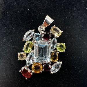 NWOT Multi-gemstone pendant all set in solid sterling silver!